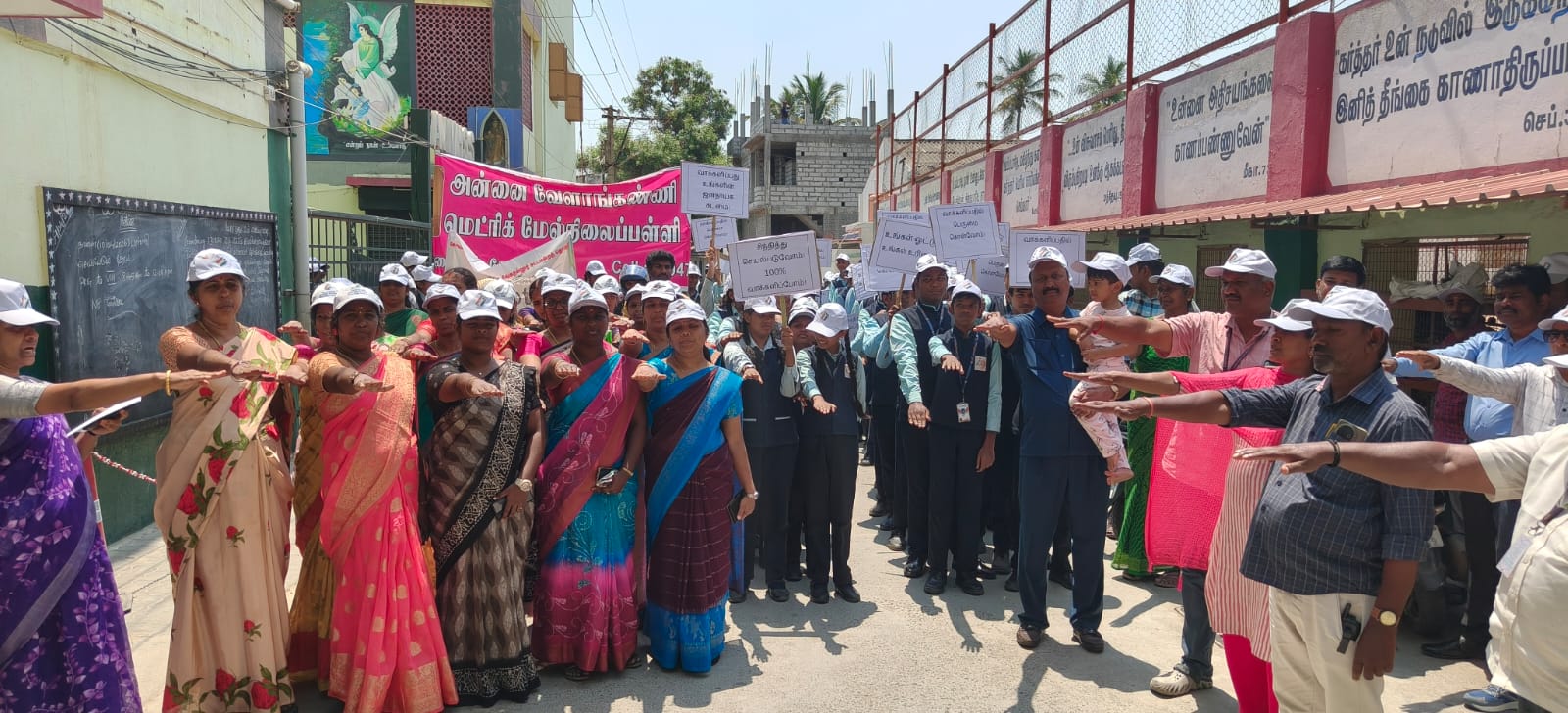 Staff and parents of Annai Velankanni School leading a community awareness walk in Sowripalayam, Coimbatore