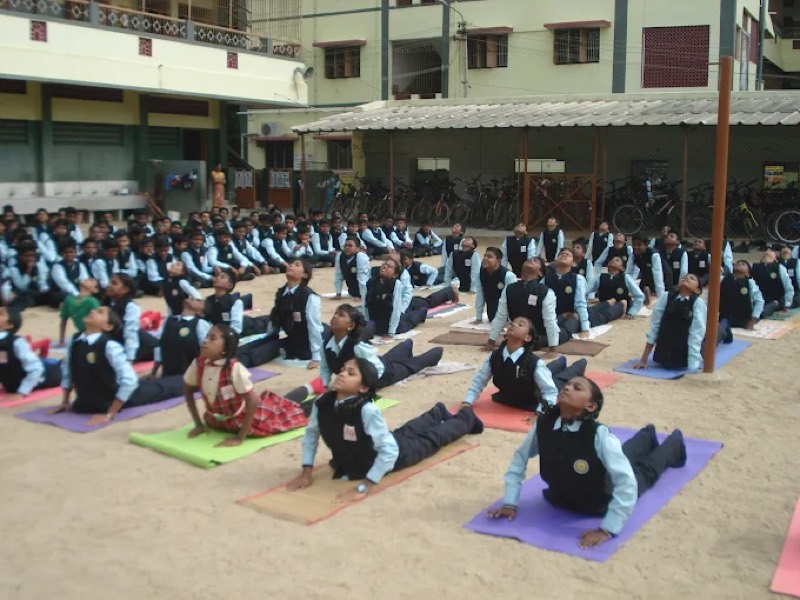 Students practising yoga together on the school grounds, Annai Velankanni School, Coimbatore