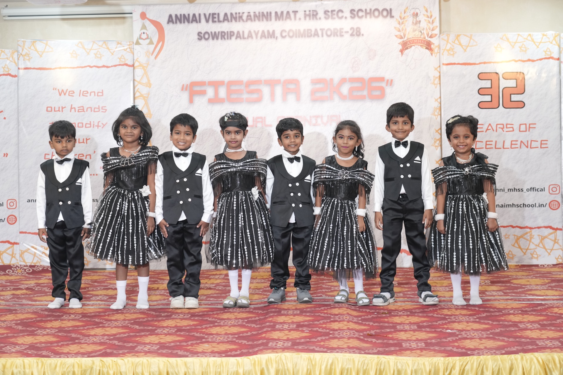 Students in formal attire for a ramp walk at the Annual Fiesta, Annai Velankanni School, Coimbatore
