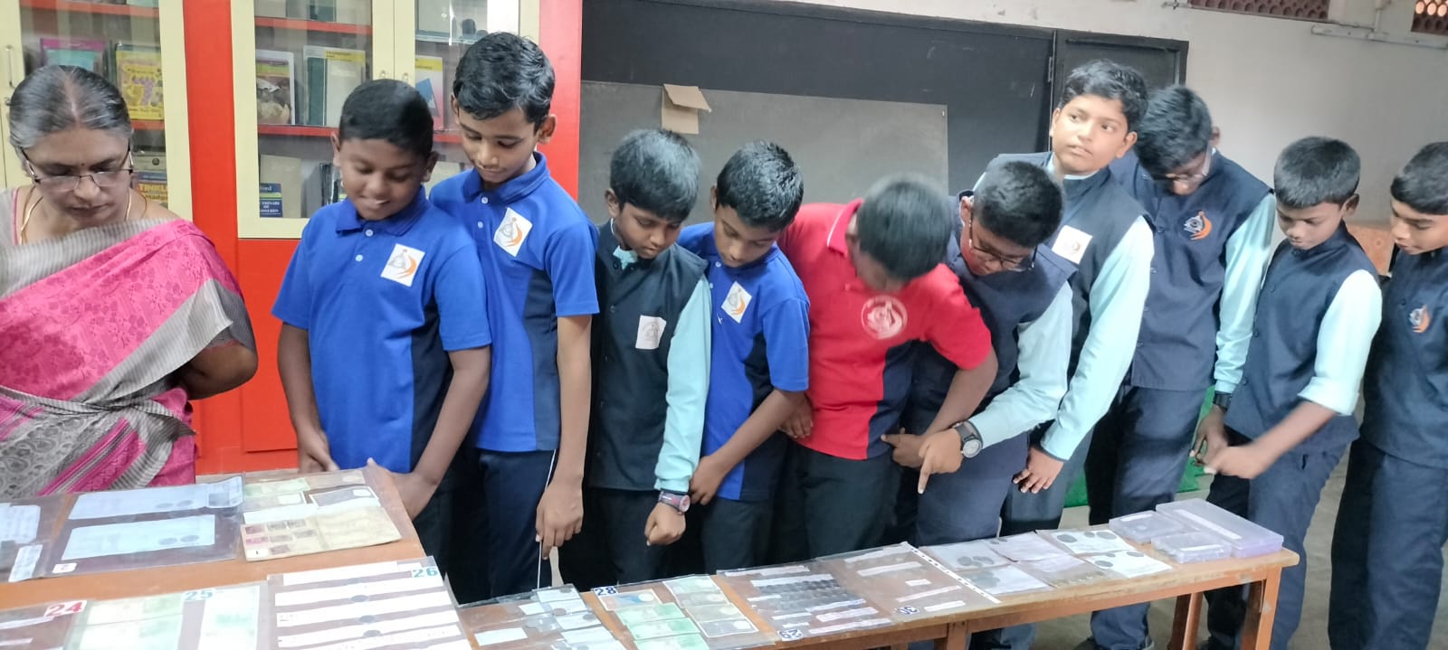 Students viewing a heritage and currency exhibition at Annai Velankanni School, Coimbatore