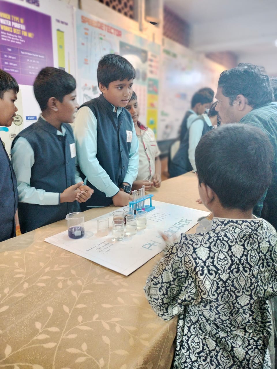 Students demonstrating a pH indicator experiment at a science exhibition, Annai Velankanni School, Coimbatore